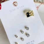 Set con Earcuff circones blancos